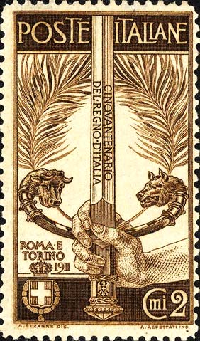 50º anniversario del regno d´Italia - Spada impugnata da una mano, l´elsa simboleggia Torino e Roma